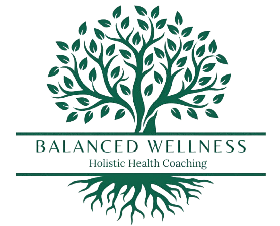 A green tree with the words balanced wellness written underneath it.